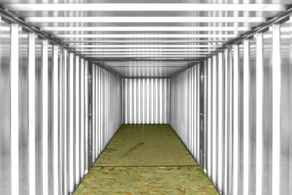 8 m (26.2 ft) Flat-Pack Container Bundle – Green, End-Linked – Interior perspective of the long linked container showing metal walls and wooden floor