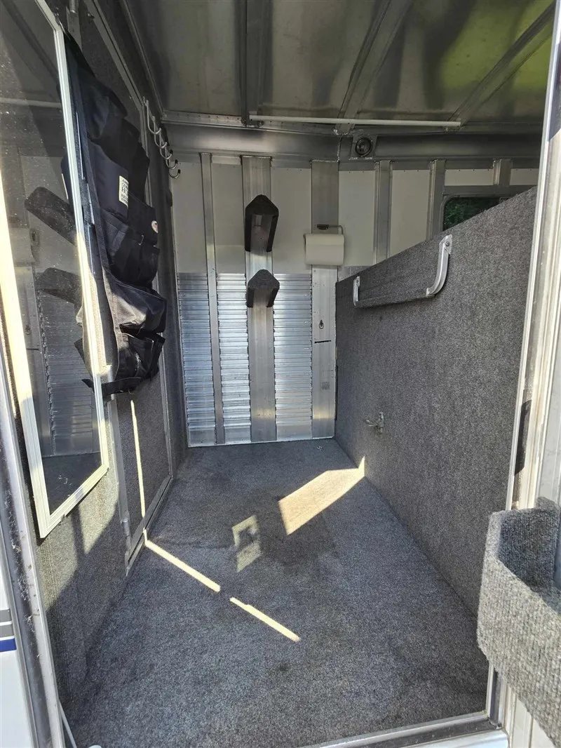 2000 C&C 2 Horse Gooseneck Trailer – Aluminum, Dressing Room – Wide shot of the dressing room interior with storage organizers and saddle racks
