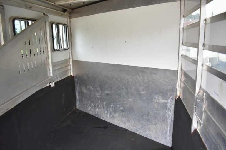 2012 CM 3 Horse Bumper Pull Trailer – Aluminum, Hayrack – Interior horse stall area showing padded walls and aluminum partitions