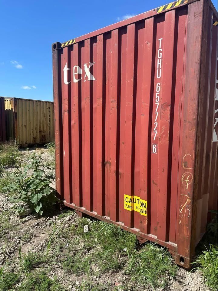 40ft High Cube Shipping Container – Used, Double Rear Doors – close exterior view of red container end in yard