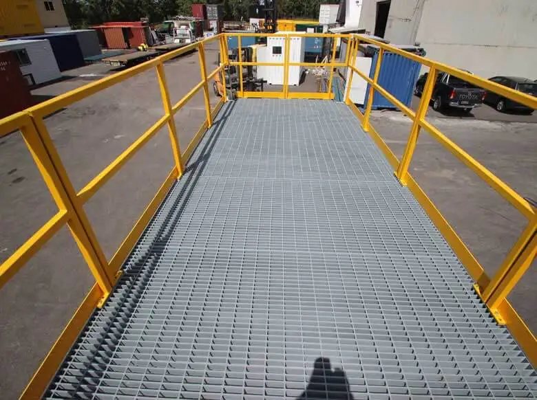 Trade Show Display Container – Lockable Steel Booth – View from above showing the metal grate roof walkway and yellow safety railing
