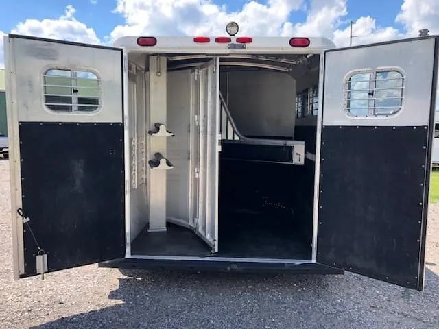 2004 4 Star 2 Horse Gooseneck Trailer – Slant Load, White – Full rear view with the double doors wide open showing the horse area