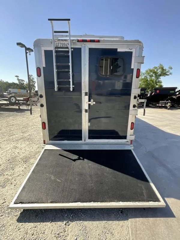 2005 Jamco 4 Horse Gooseneck Trailer – Blue, Air Suspension – Rear view of the trailer with the loading ramp deployed