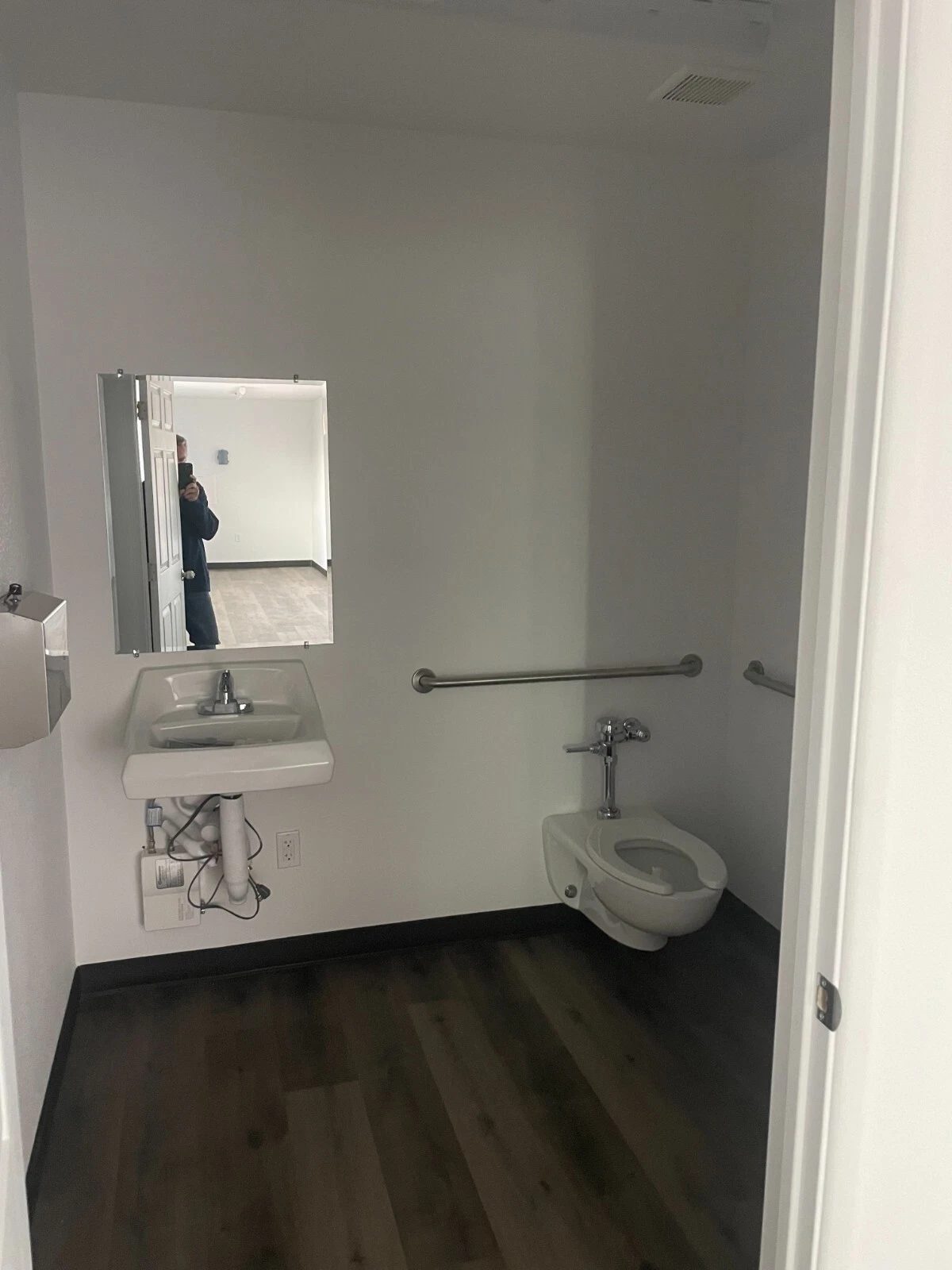 40ft Converted Container Office – Accessible Restroom – restroom with wall-mounted sink, toilet, mirror and grab bars