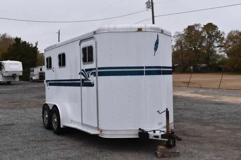 1995 Featherlite 2 Horse Trailer – Aluminum, Dressing Room – Front three-quarter view from the right side showing the hitch and entry door