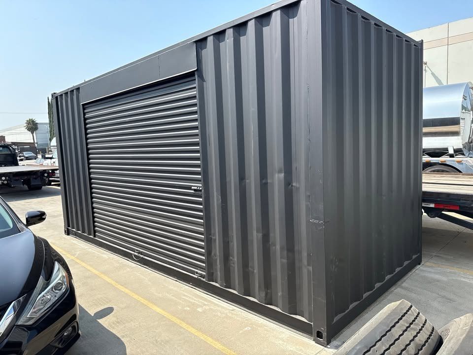 20ft Used Shipping Container – Matte Black, Side Roll-Up Door – three-quarter exterior view with closed side roll-up door