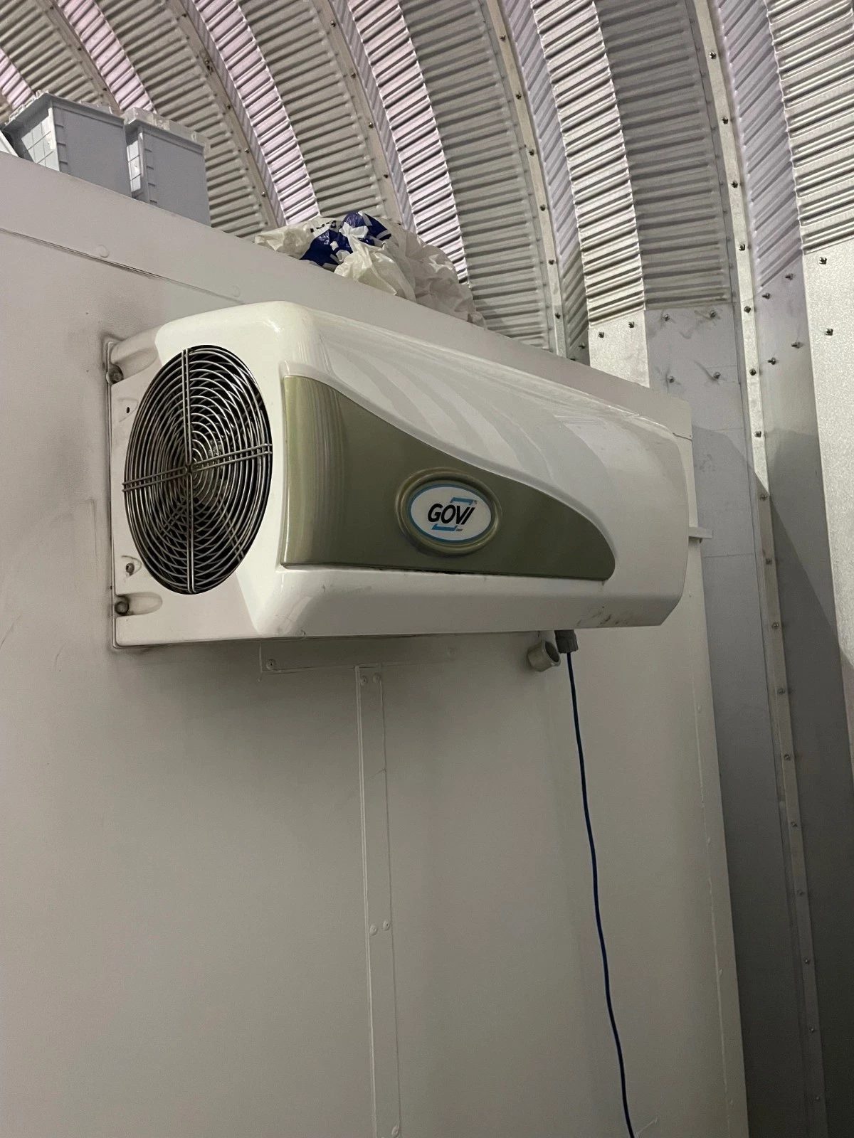 10ft Refrigerated Shipping Container – Fridge and Freezer – close-up of refrigeration unit mounted on white container wall