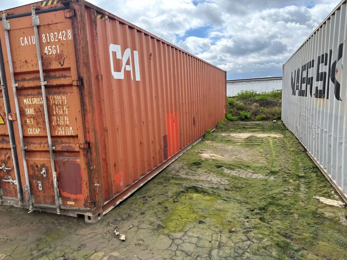 40ft Used Shipping Container – Secure Double Cargo Doors – three-quarter exterior of rusty container with closed cargo doors