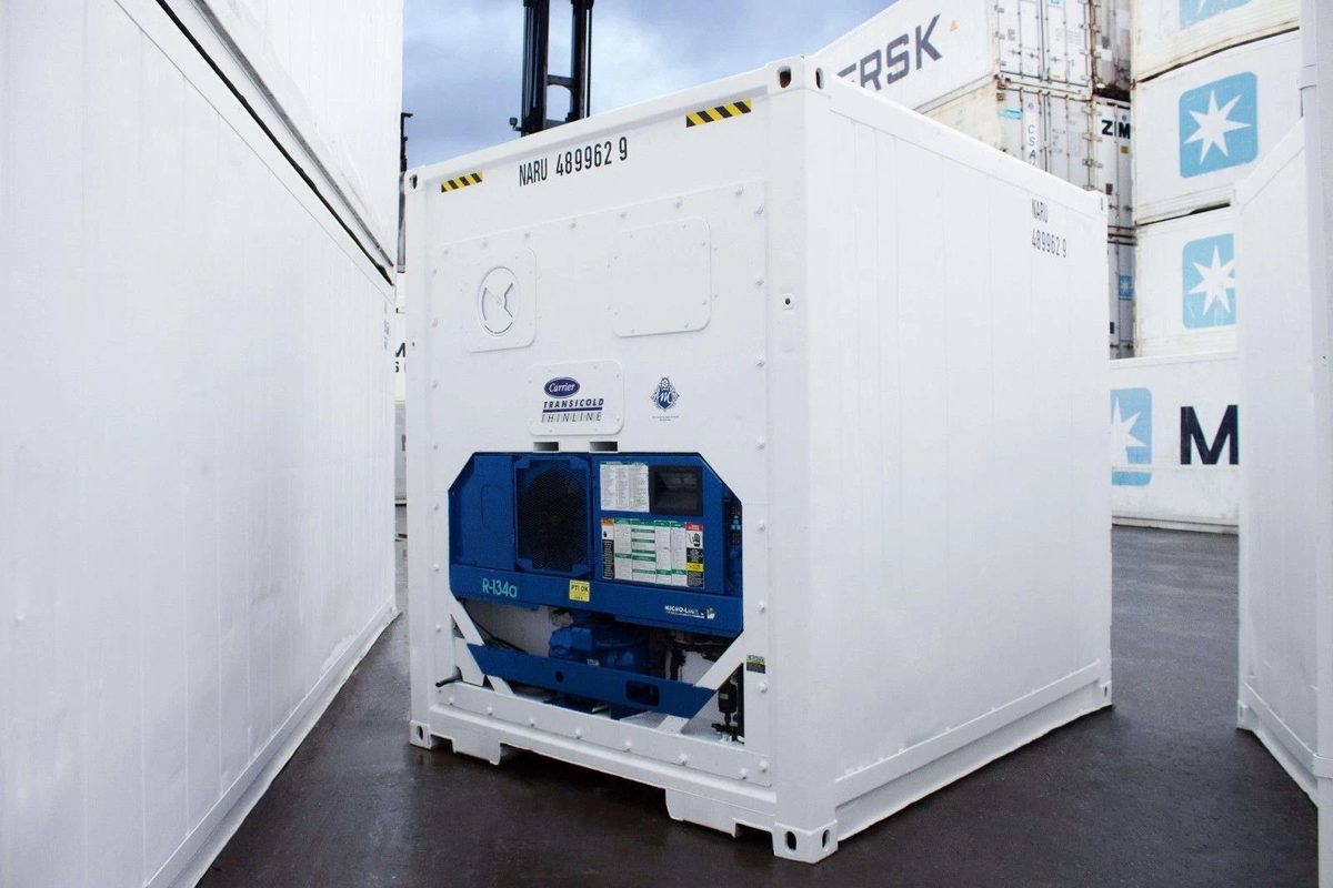 10ft Refrigerated Shipping Container – Compact Cold Storage – White compact refrigerated container with blue cooling equipment among stacked containers