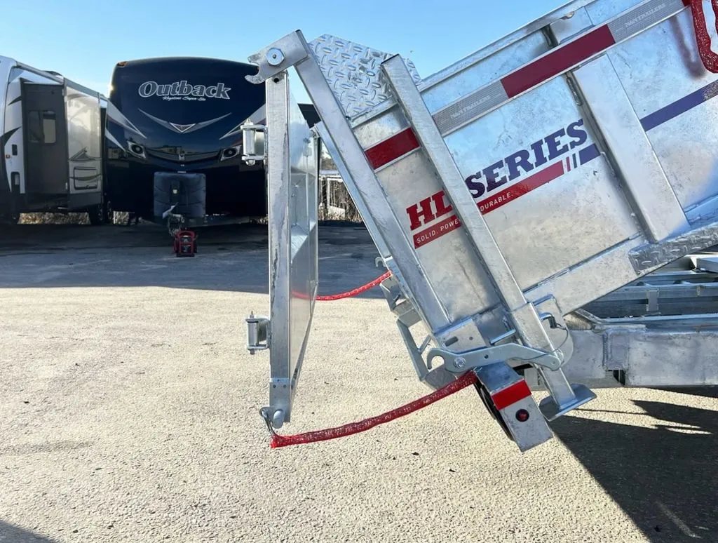 2024 N&N Trailers 14 ft Dump – Galvanized Steel – Close-up of the two-way spreader gate mechanism at the rear of the bed
