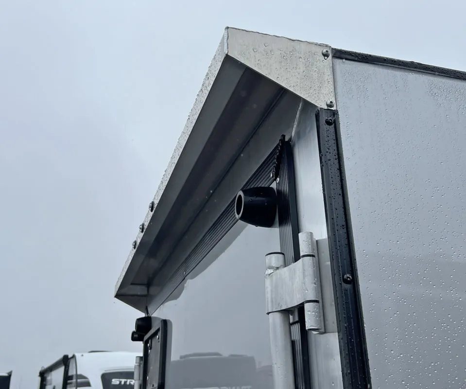2024 Mission Trailers Crossover Trailer – Galvanized Package – Close-up of the rear canopy over the ramp door with light