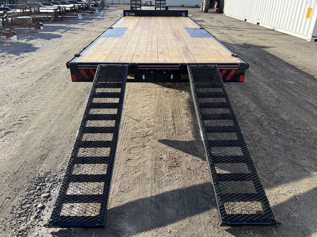 2024 Diamond C 22 ft Deckover Trailer – Slide-In Ramps – Rear view looking up the trailer deck with two black mesh ramps extended
