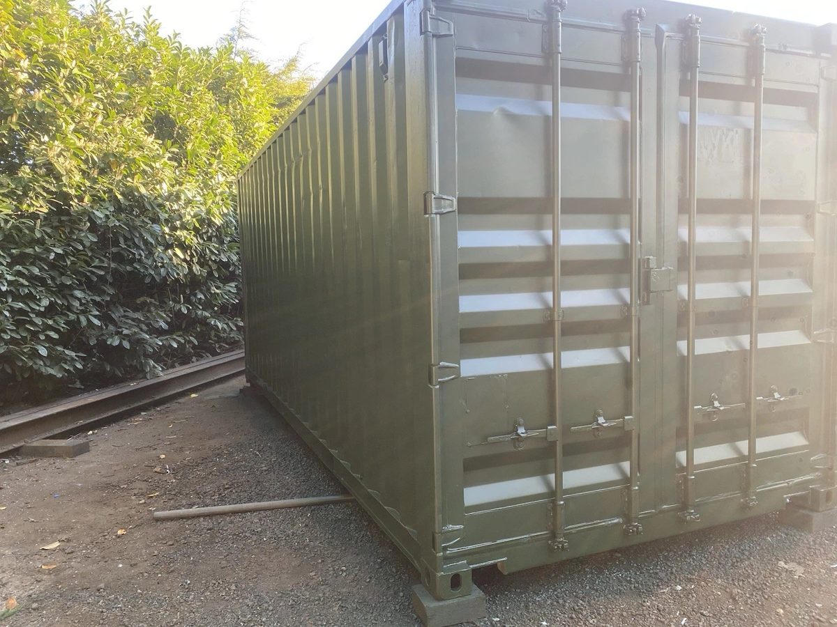 20ft Refurbished Shipping Container – Full-Length Side Access – three-quarter exterior view of green container with closed cargo doors