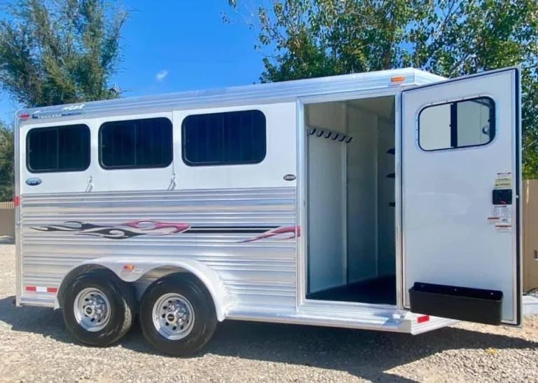 2011 Cimarron 3 Horse Bumper Pull – Insulated Roof – Side view with tack room door open showing interior space