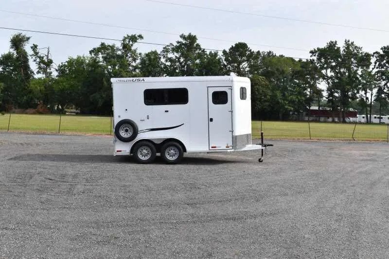 2019 Trailers USA 2 Horse Trailer – Aluminum, Dressing Room – Full profile view of the curbside of the white horse trailer outdoors