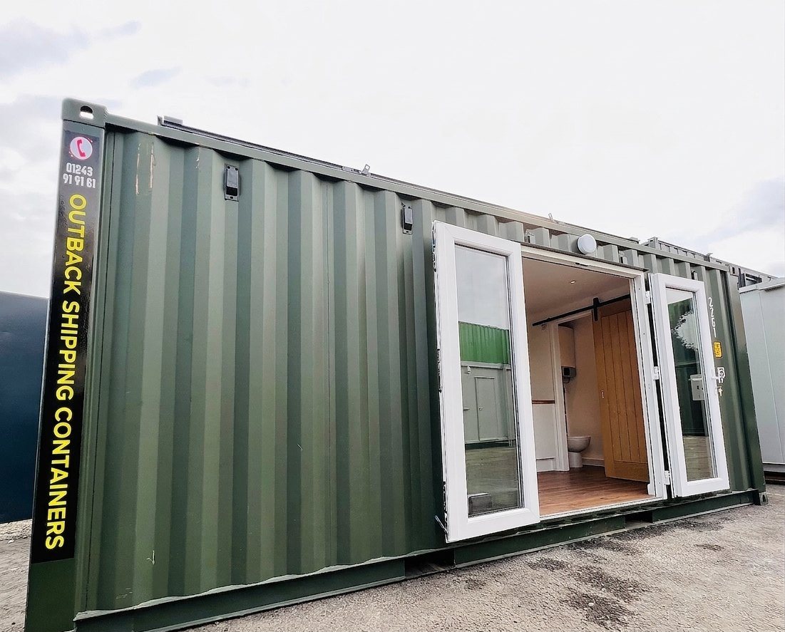 20ft Container Home – One Bed Box, 1 Bedroom – A refurbished 20x8 shipping container converted into a modern living space featuring double glass doors and interior wood finishes