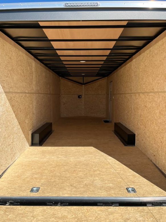 2026 Millennium 24 ft Car Hauler – Charcoal Hero – Interior view looking toward the front V-nose section showing floor and ceiling