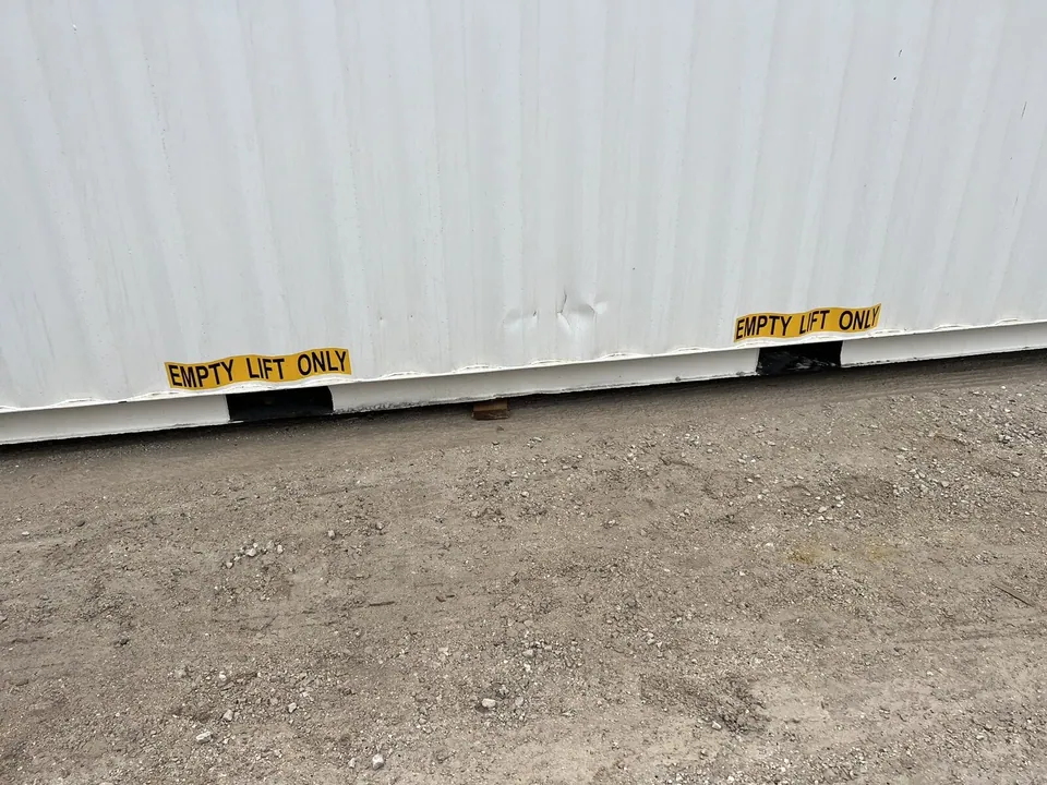 40ft High Cube Shipping Container – One-Trip, Double Doors – lower container side with forklift pockets and lifting warning labels