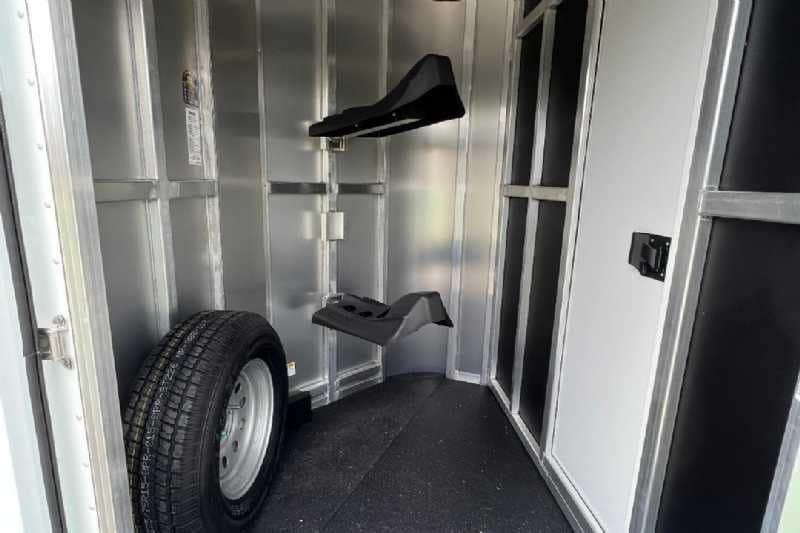 2023 Shadow 2HSSR 2 Horse Trailer – Extended Box – Front tack room interior with spare tire and saddle racks
