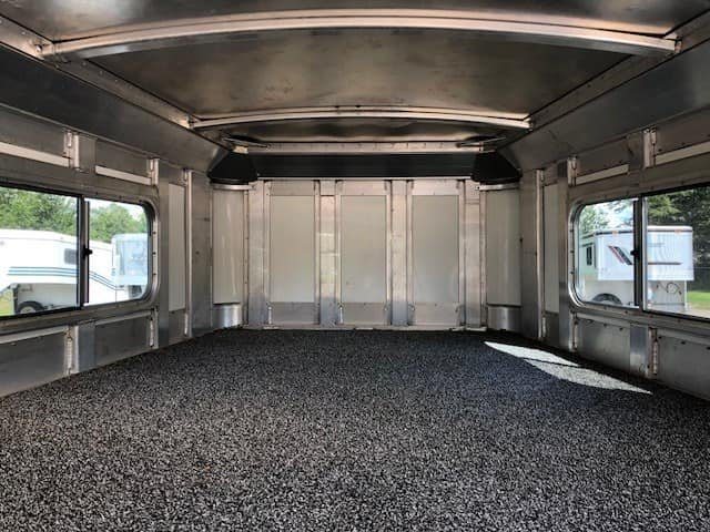 2004 4 Star 2 Horse Gooseneck Trailer – Slant Load, White – Spacious interior view of the gooseneck nose area with dark rubber floor matting