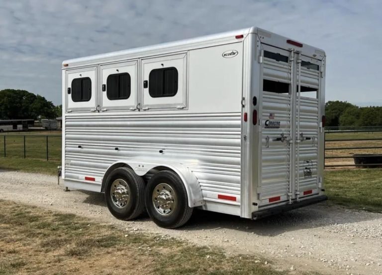 2013 Cimarron 3 Horse Bumper Pull – Aluminum, Dressing Room – Three-quarter rear view of a white and silver livestock trailer