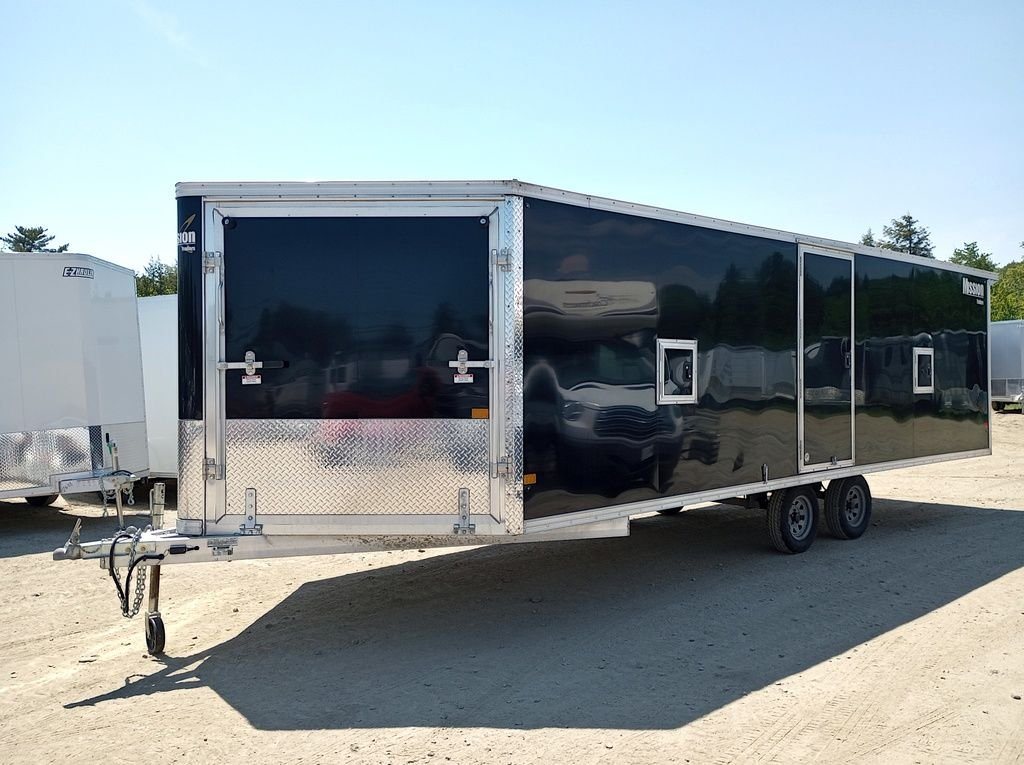 Mission Trailers 22 ft Snowmobile Trailer – 4-Place – Front three-quarter view of a black enclosed trailer with aluminum trim and diamond plate