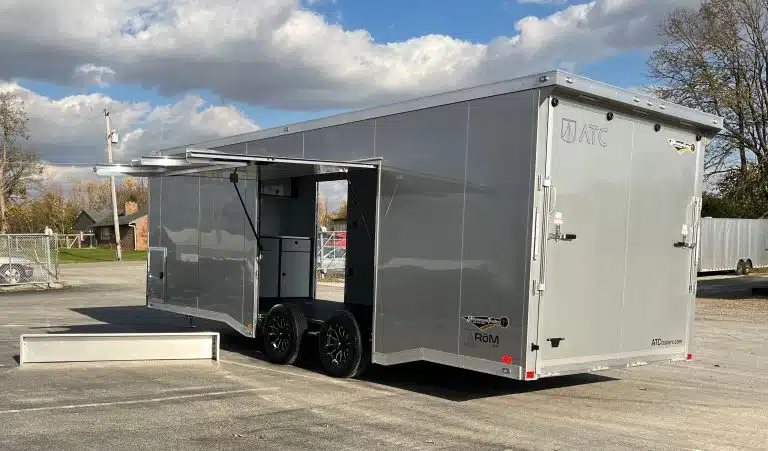 2026 ATC 24 ft Car Trailer – Silverfrost, Plus Package – Rear and side view of the trailer with the escape door open