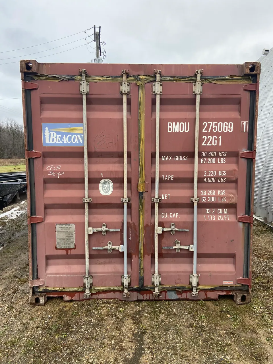 20ft Used Shipping Container – Double Cargo Doors – straight-on view of weathered container with cargo doors closed