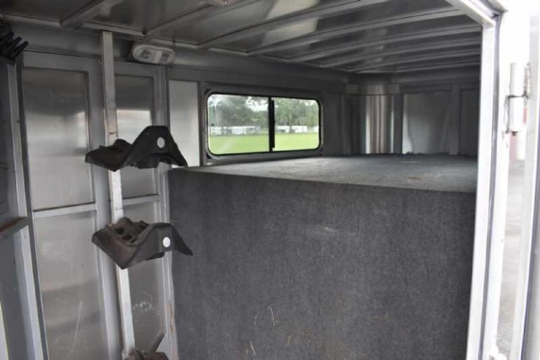 2018 Adam 3 Horse Gooseneck Trailer – Dressing Room – Interior of the front dressing room showing saddle racks and a window