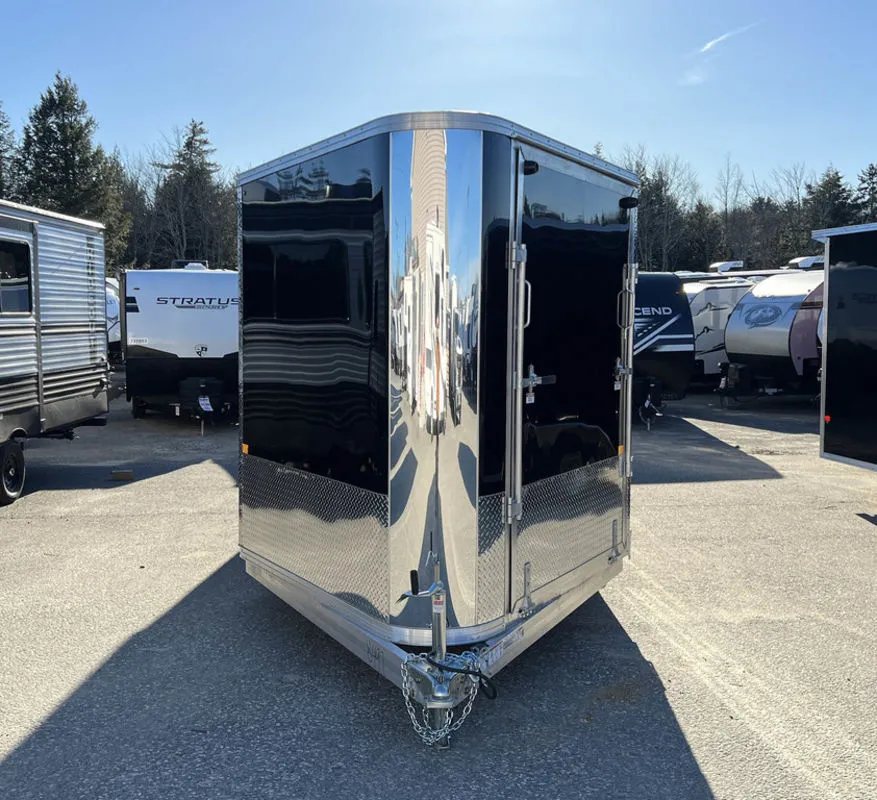 2024 Sno Pro 22 ft Snowmobile Trailer – Extra Height – Straight front view of the wedge nose trailer with diamond plate rock guard