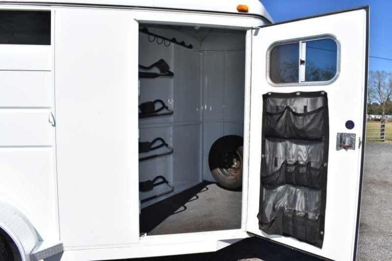 2002 Logan Coach 3 Horse Trailer – Steel, Dressing Room – Front tack room area with open door showing saddle racks and organizer