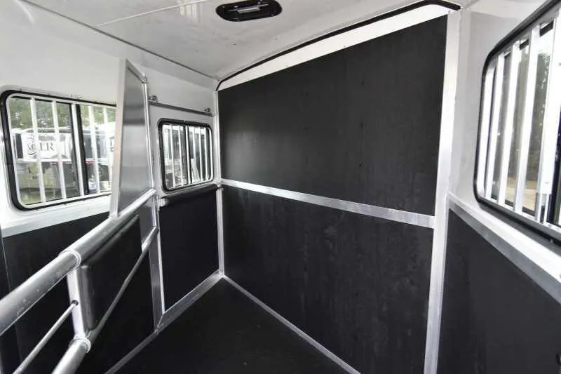 2016 Shadow 2HBP 2 Horse Bumper Pull Trailer – Aluminum – Wide interior shot of horse trailer stall showing black padded walls