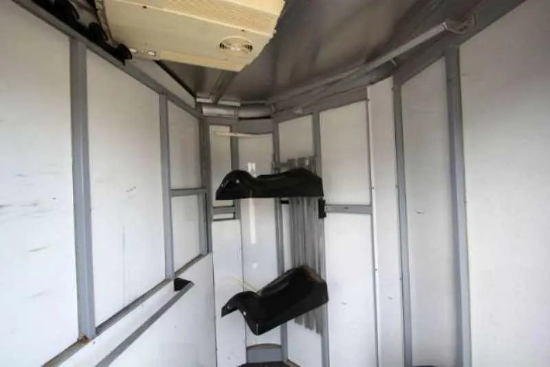 2003 Sundowner 2 Horse Trailer – Dressing Room – Front nose area of the tack room with saddle racks