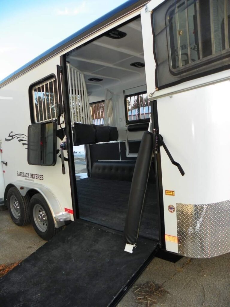 2022 Double D 2 Horse Bumper Pull – Reverse Slant – Side view of the rear ramp extended to the ground for loading