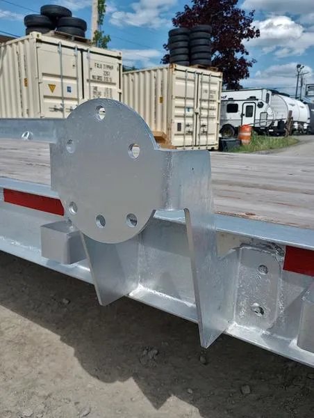 2024 N&N Trailers 20 ft Equipment Trailer – Full-Width Ramps – Close up view of a galvanized spare tire mount on the trailer side