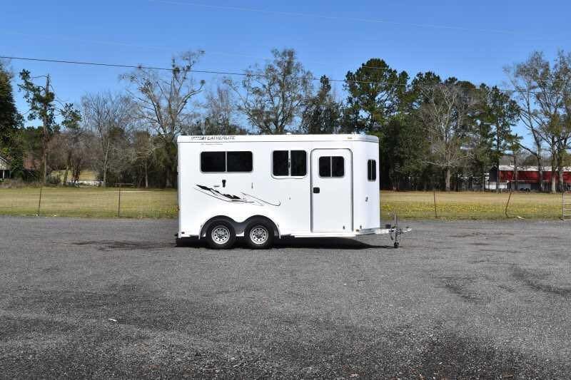 2005 Featherlite 2HST Horse Trailer – Walk-Through Dressing Room – Wide side view of a white horse trailer in an open lot