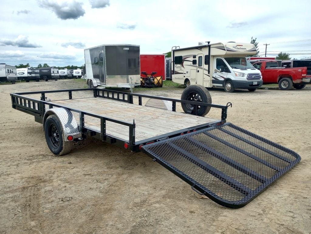 2024 PJ Trailers 14 ft Utility – Side Loading Ramps – Rear side view of utility trailer with the mesh ramp gate extended down