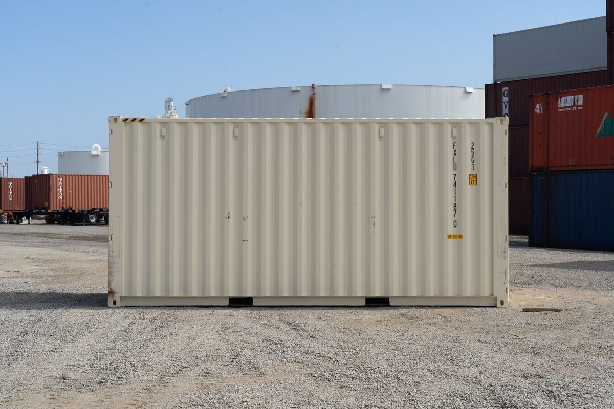 20ft High Cube Shipping Container – New One-Trip, Double Doors – straight side view of cream container in storage yard