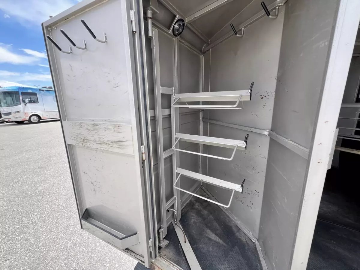 2001 Titan 3 Horse Gooseneck Trailer – Steel, Dressing Room – Interior of the tack room featuring saddle racks and bridle hooks