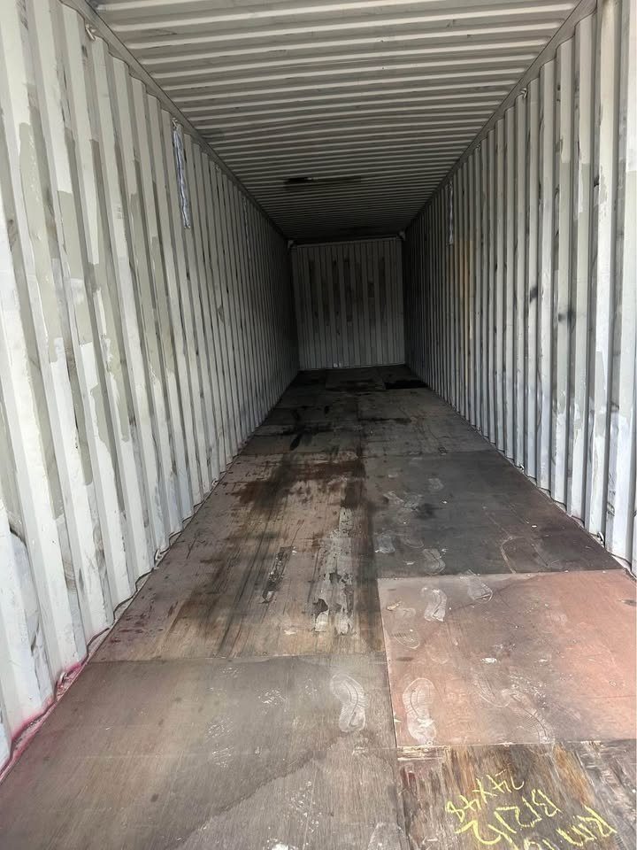 45ft High Cube Shipping Container – Extended Cargo Space – empty container interior with worn plywood floor and corrugated walls