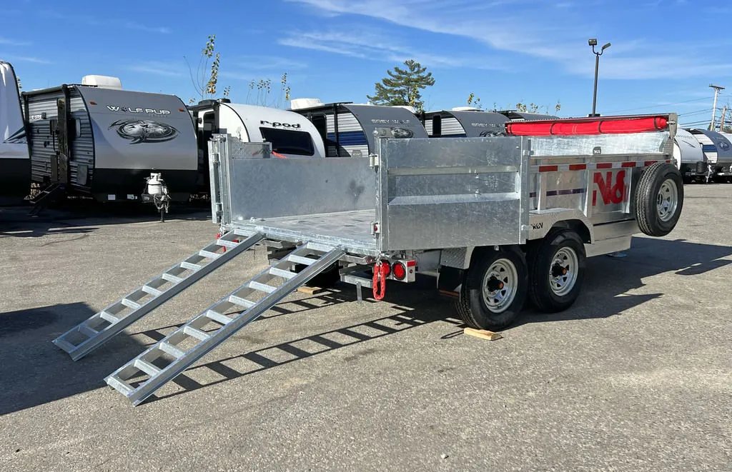 2024 N&N Trailers 14 ft Dump – Galvanized Steel – Rear view showing the bed lowered and the ramps deployed for loading