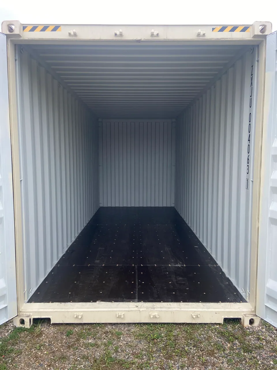 20ft High Cube Shipping Container – One-Trip, Extra Height – empty container interior with dark flooring and open doors