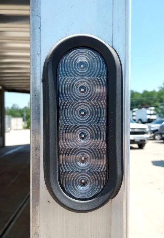 Mission Trailers 22 ft Snowmobile Trailer – 4-Place – Close-up of a vertical oval LED tail light mounted on the aluminum frame