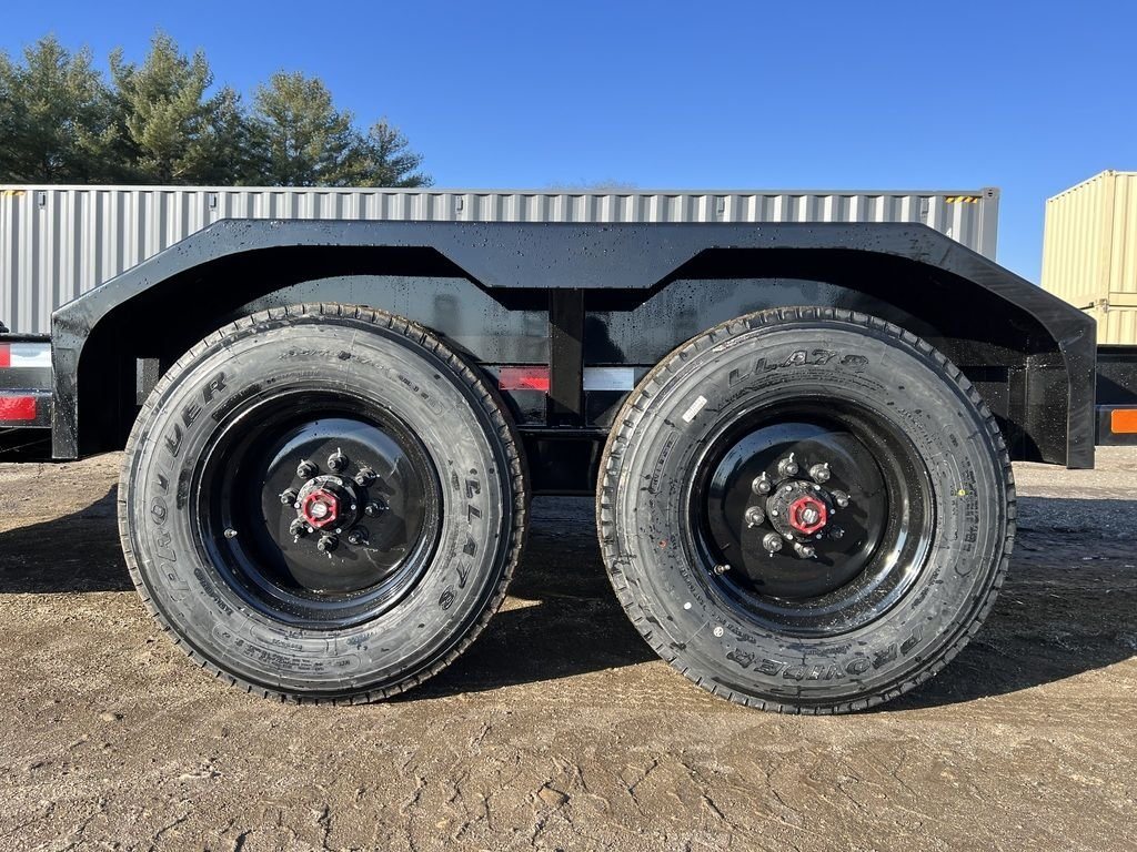 2024 Rice Trailers 18 ft Equipment Trailer – Hydraulic Jack – Close-up of the dual axles and tires under a black metal fender