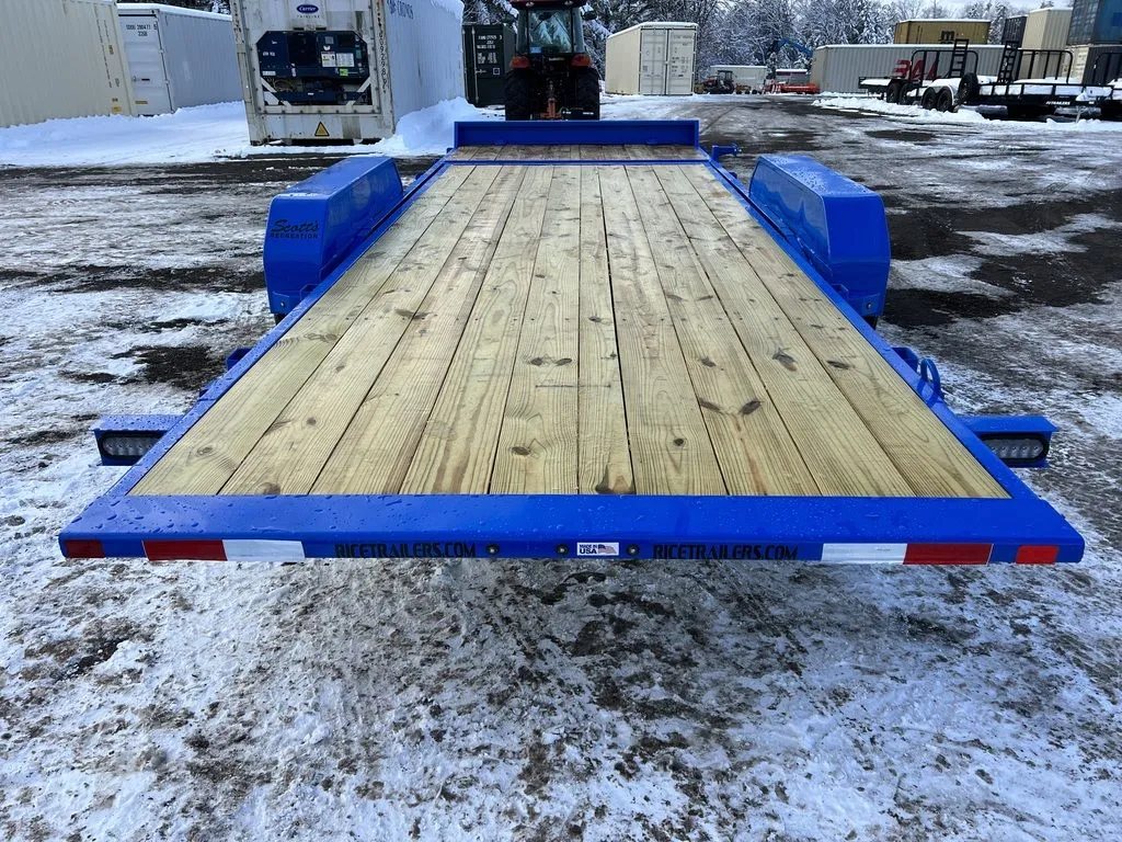 2024 Rice Trailers 20 ft Tilt Trailer – Spare Mount – A direct rear view of the trailer showing the wood deck and blue frame