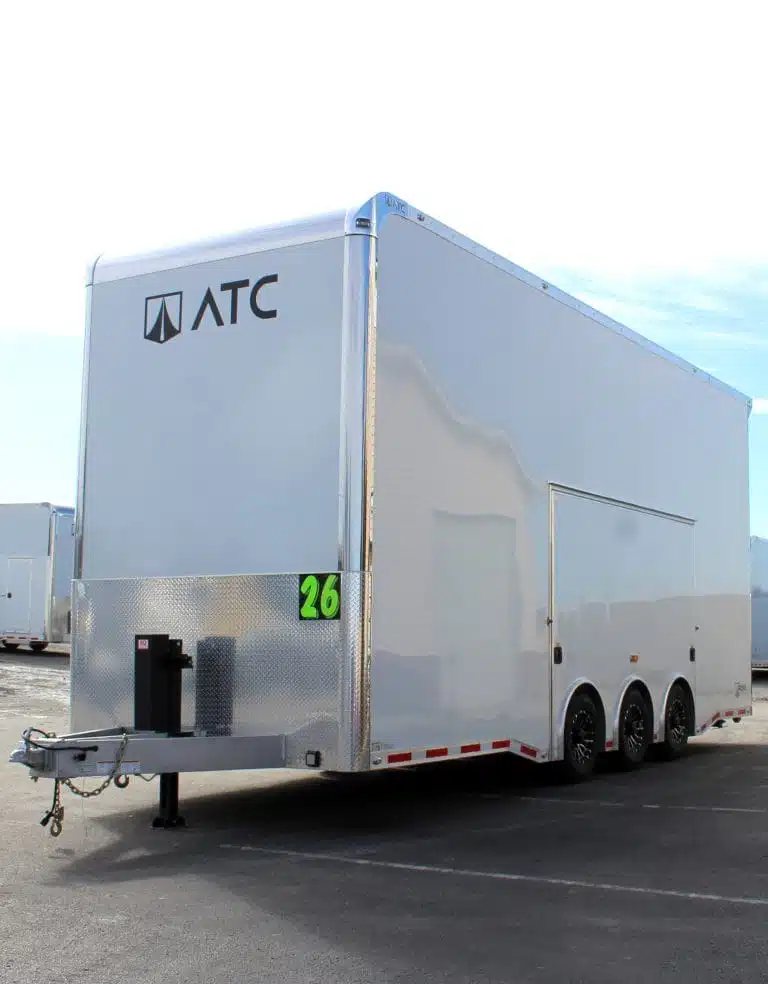 2026 ATC 26 ft Stacker Trailer – Tiltable Lift – Front three-quarter view of a white enclosed triple-axle aluminum stacker trailer