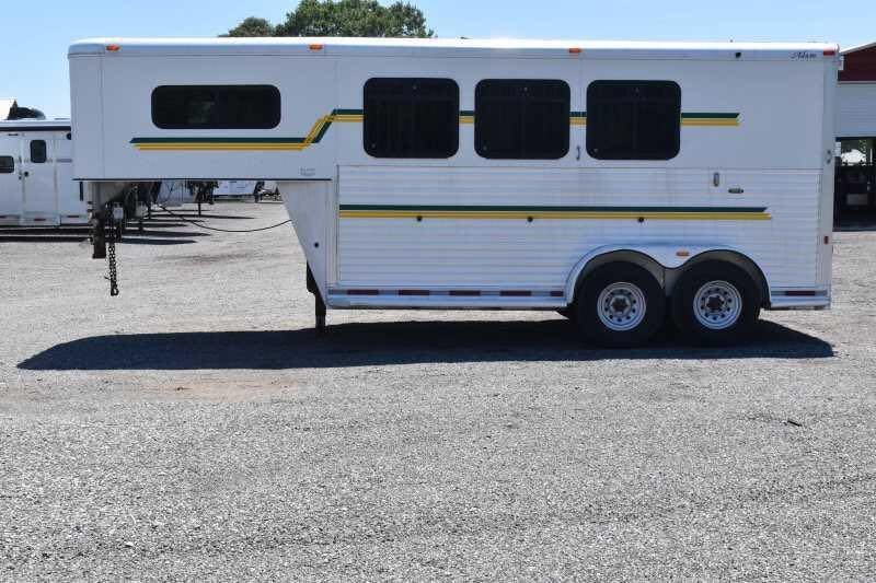 2006 Adam 7302 3 Horse Trailer – Aluminum, Dressing Room – Clear side view of the white horse trailer with green stripes