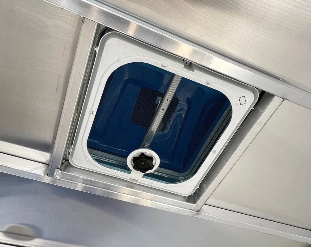 2024 Sno Pro 22 ft Snowmobile Trailer – Extra Height – White plastic roof vent with a manual crank handle on the interior ceiling