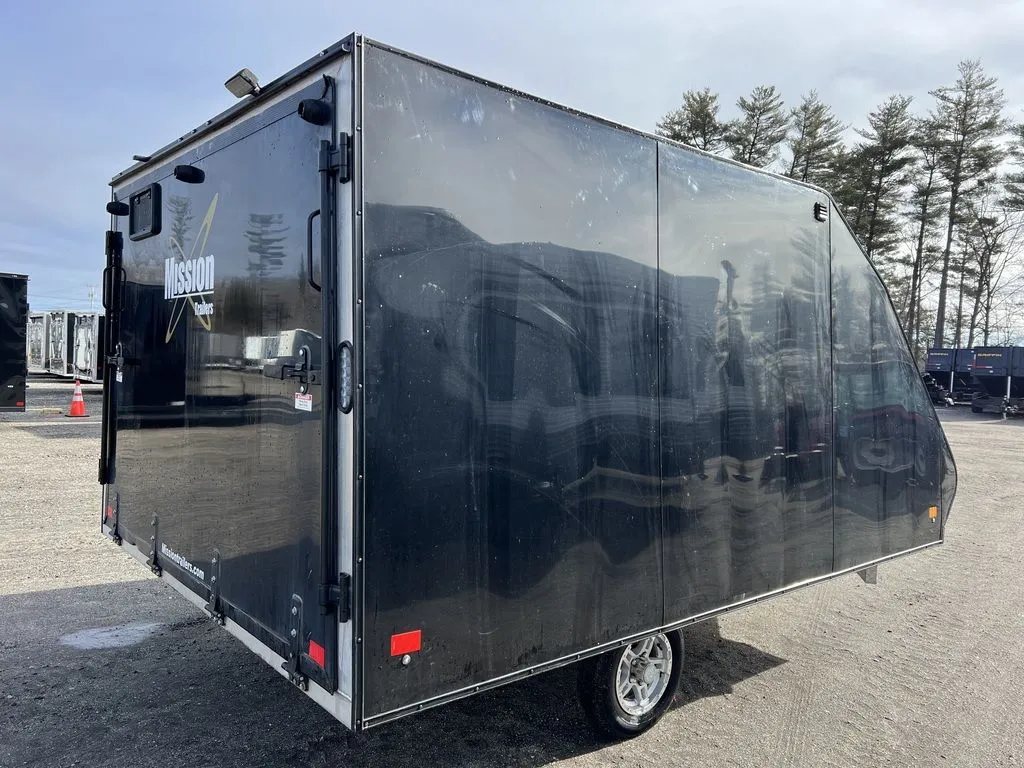 2021 Mission Trailers 2-Place Hybrid – Blackout Package – Rear three-quarter view from the right side showing the closed ramp door