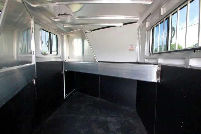 2016 Sundowner 3 Horse Gooseneck – Aluminum, Dressing Room – Horse stalls with metal dividers, rubber-lined walls, and sliding windows with bars